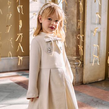 فستان ذهبي محبوك بفيونكة للبنات